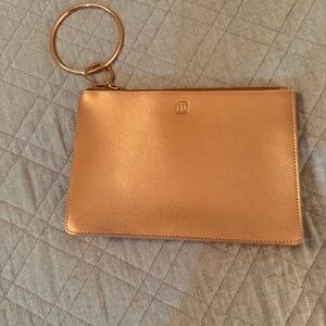 Small clutch purse with wrist holder